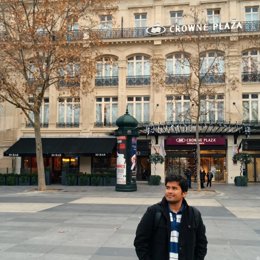 Lavi on a Paris square in front of a grand hotel in winter